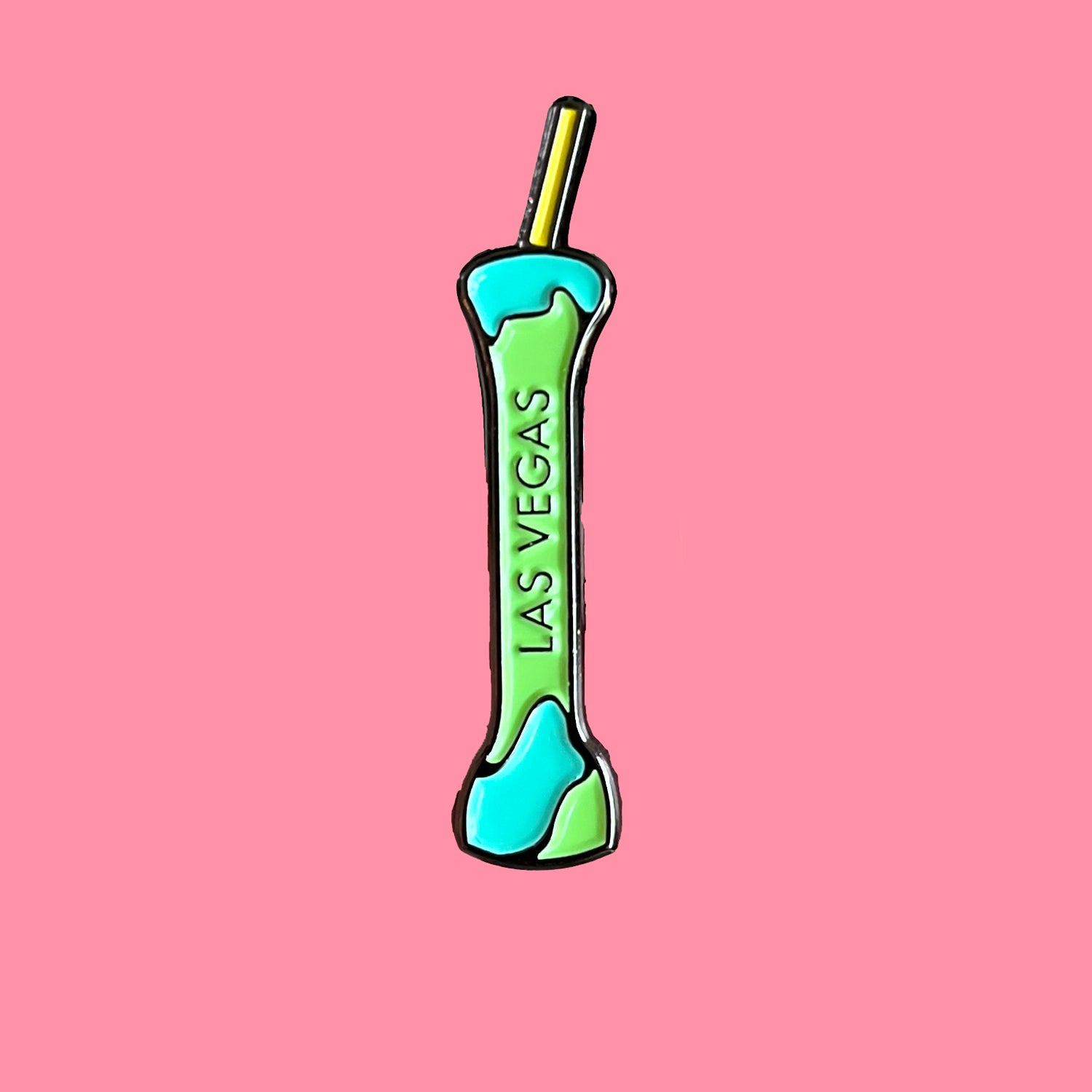 Green and blue object with 'Las Vegas' text on a pink background